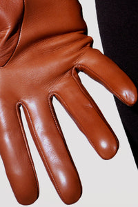 Fingers in brown unlined short leather gloves by Ines Gloves