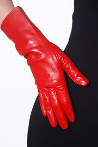 Hand wearing  red unlined short leather gloves by Ines Gloves