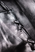 Detail of long leather gloves with corset closing by Ines
